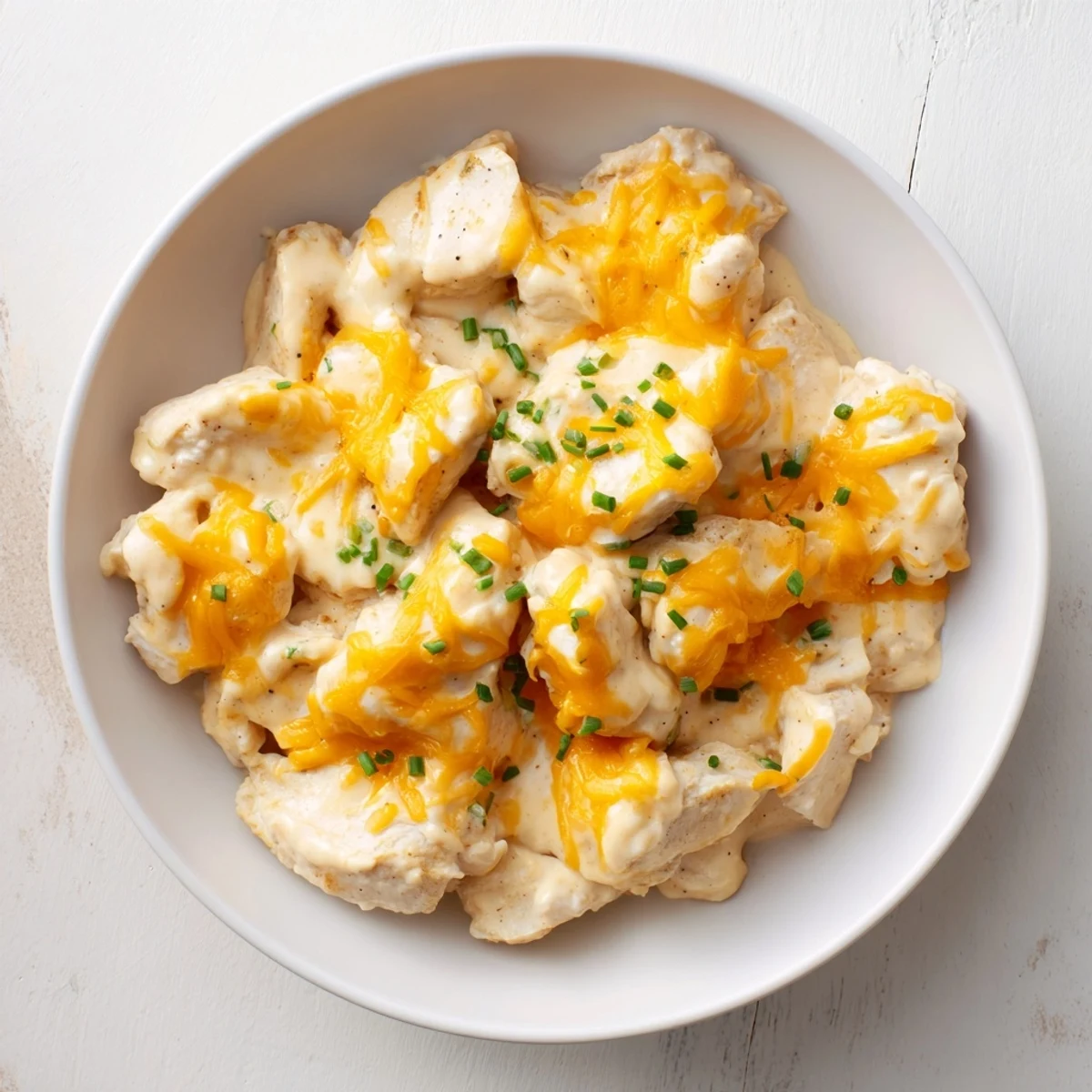 Golden, bubbly Cheddar Ranch Chicken Bake topped with melted cheese, a comforting family dinner.
