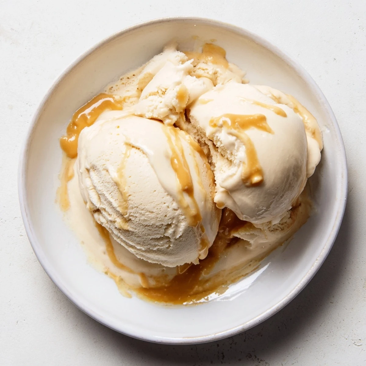 A close-up view of homemade Peanut Butter Banana Ice Cream, perfectly blended with hints of peanut butter flavor.