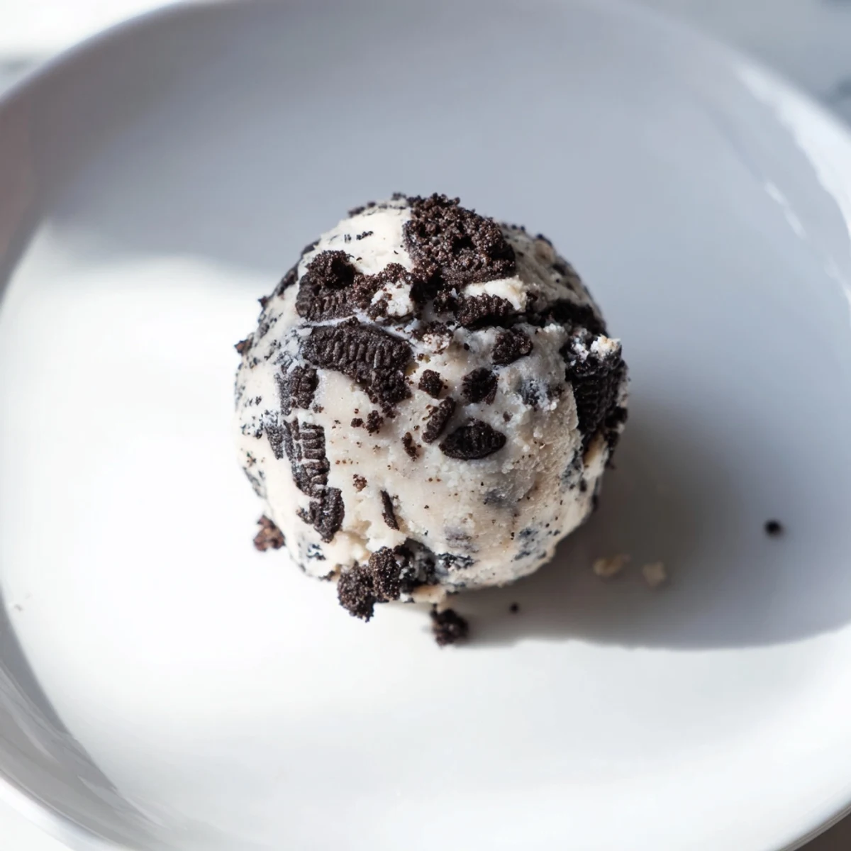 Enjoy the delicious texture of these homemade Cream Cheese Oreo Protein Balls, a tasty and healthy treat.