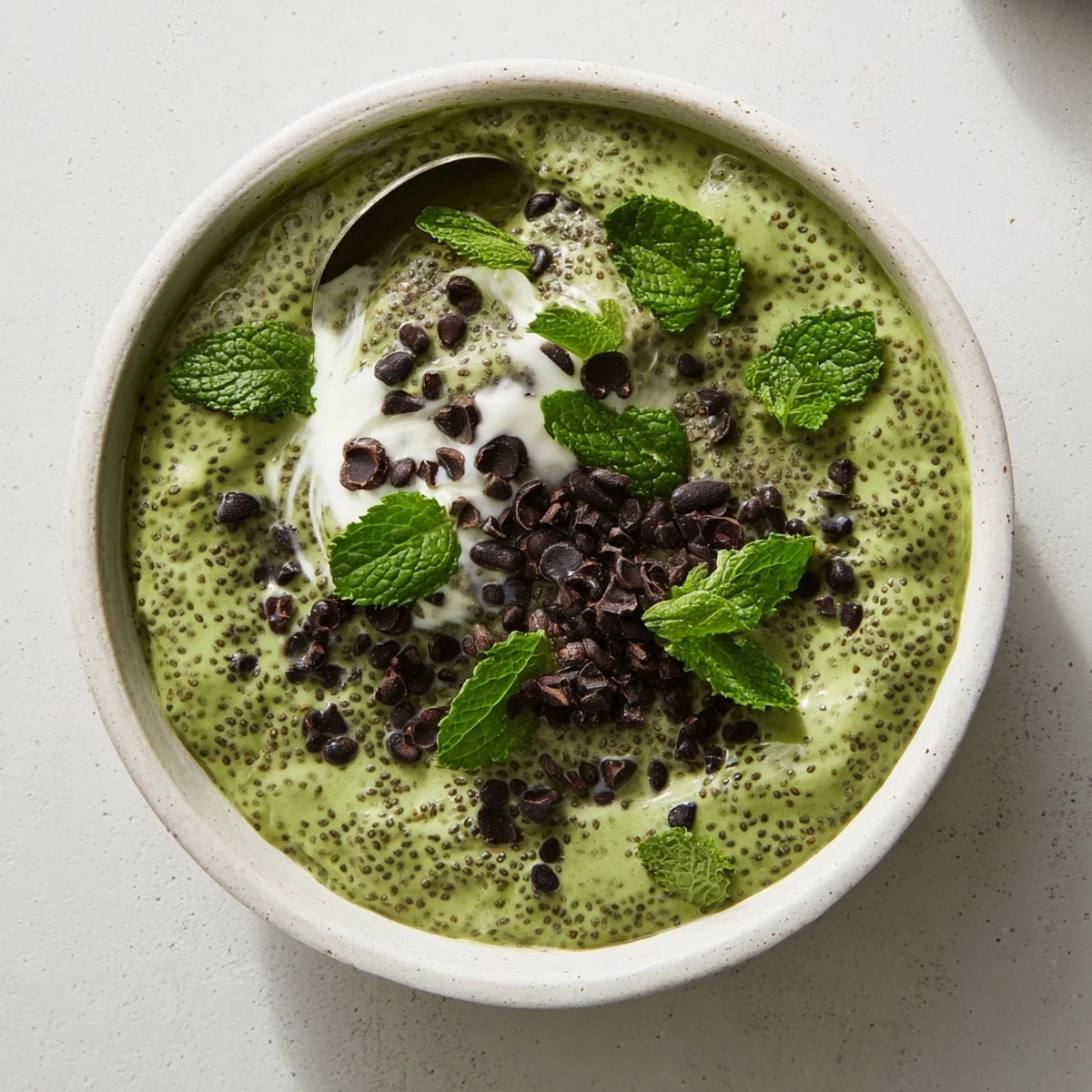 Creamy, refreshing Grinch Green Mint Matcha Breakfast Chia Pudding, perfect vegan breakfast with fresh berries.