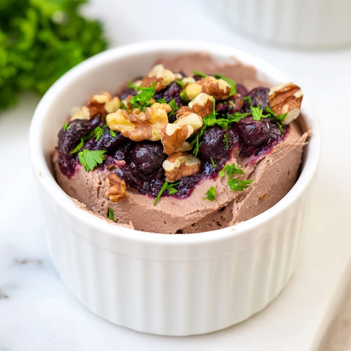 Velvet Underground appetizer, layered with creamy pâté, sweet jams, and crunchy nuts, ready to serve.