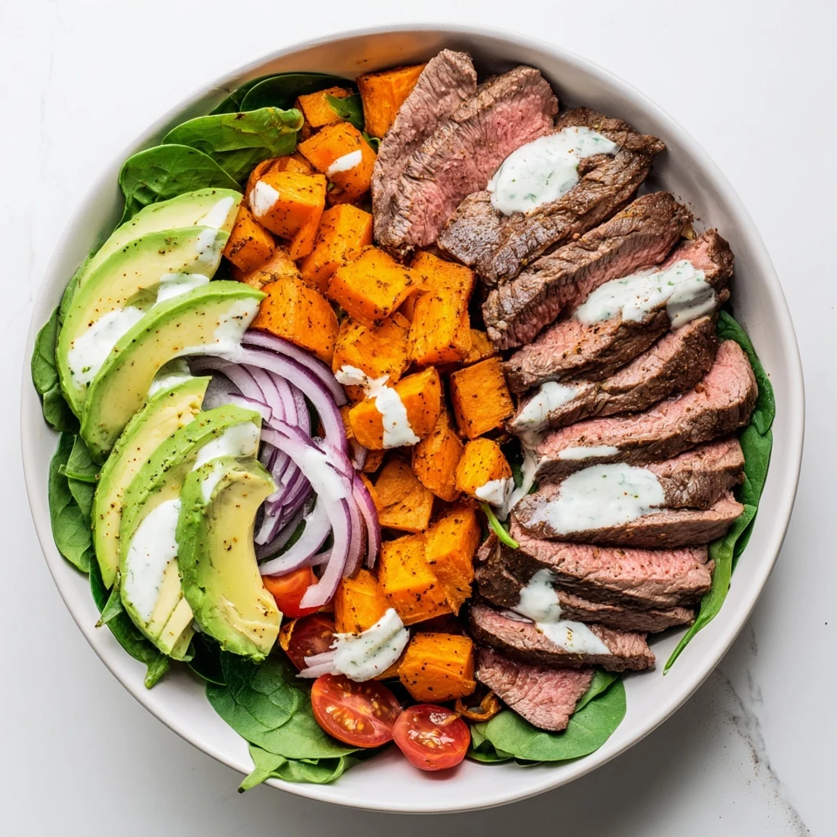 Steaming, tender beef avocado sweet potato bowl with creamy avocado and fresh cilantro, ready to eat.