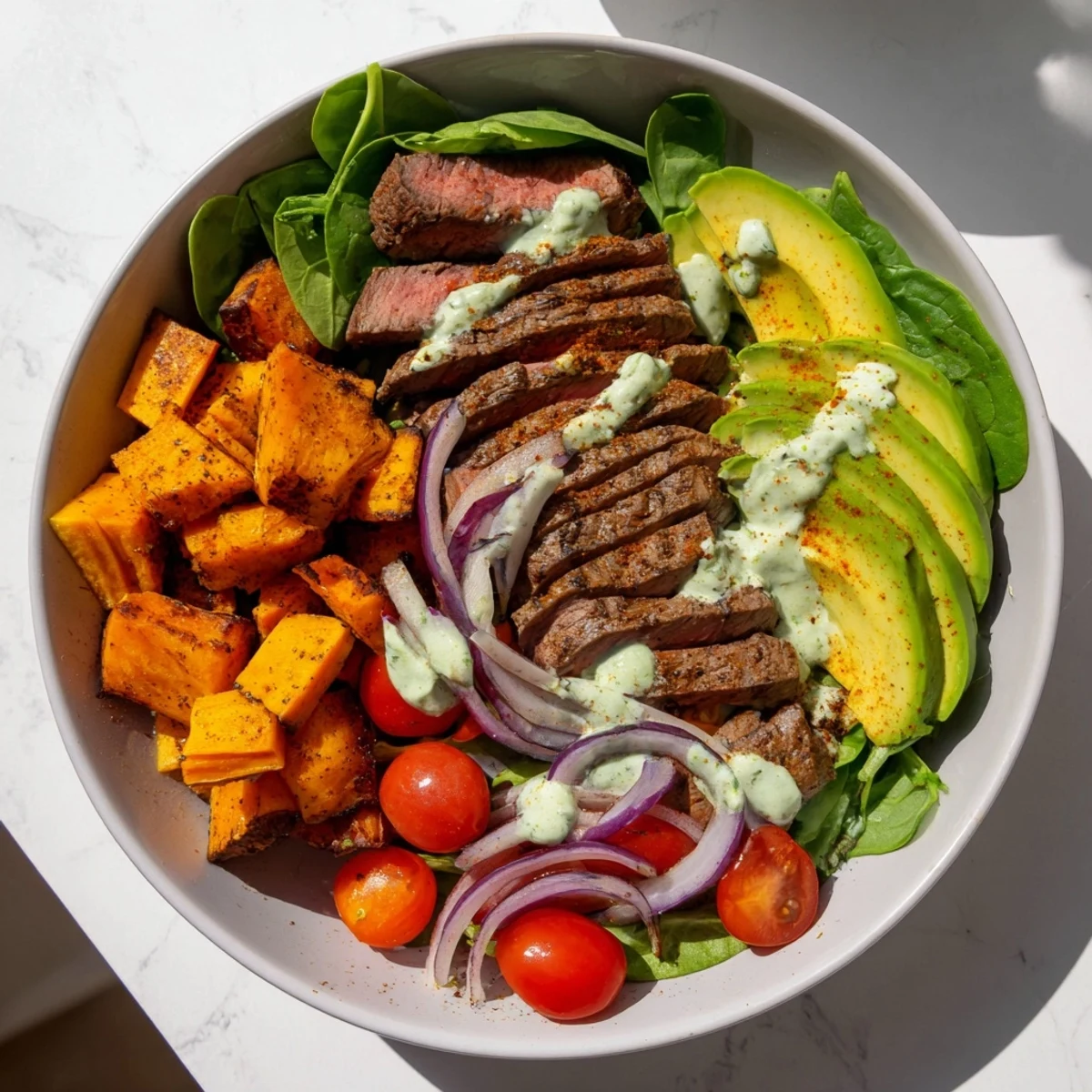 Close-up of a delicious beef avocado sweet potato bowl, perfect for a healthy and satisfying dinner.