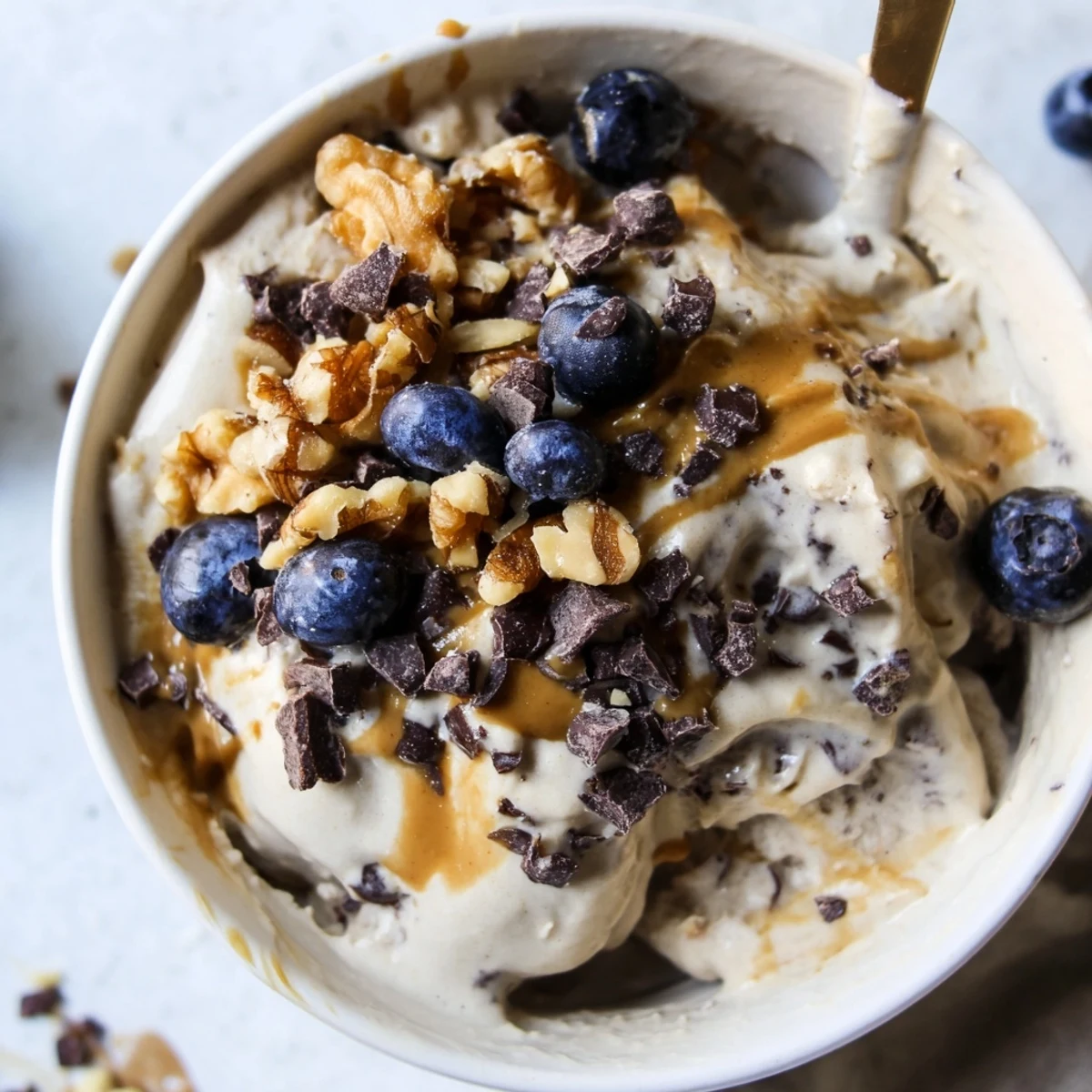 Homemade Protein Ice Cream Bowl has a smooth texture, perfect for a healthy dessert or post-workout fuel.