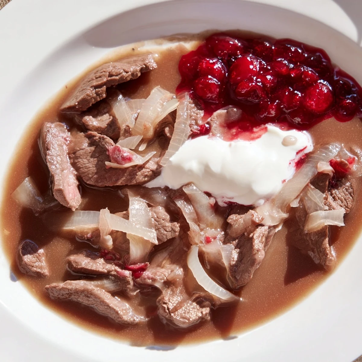 Imagine savoring this authentic Finnish Reindeer Stew, with soft meat and the tangy sweetness of lingonberries.