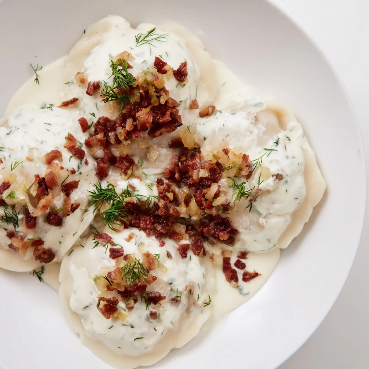 Close-up of golden-brown Cepelinai, showing the potato dumpling contrasted with rich meat filling.