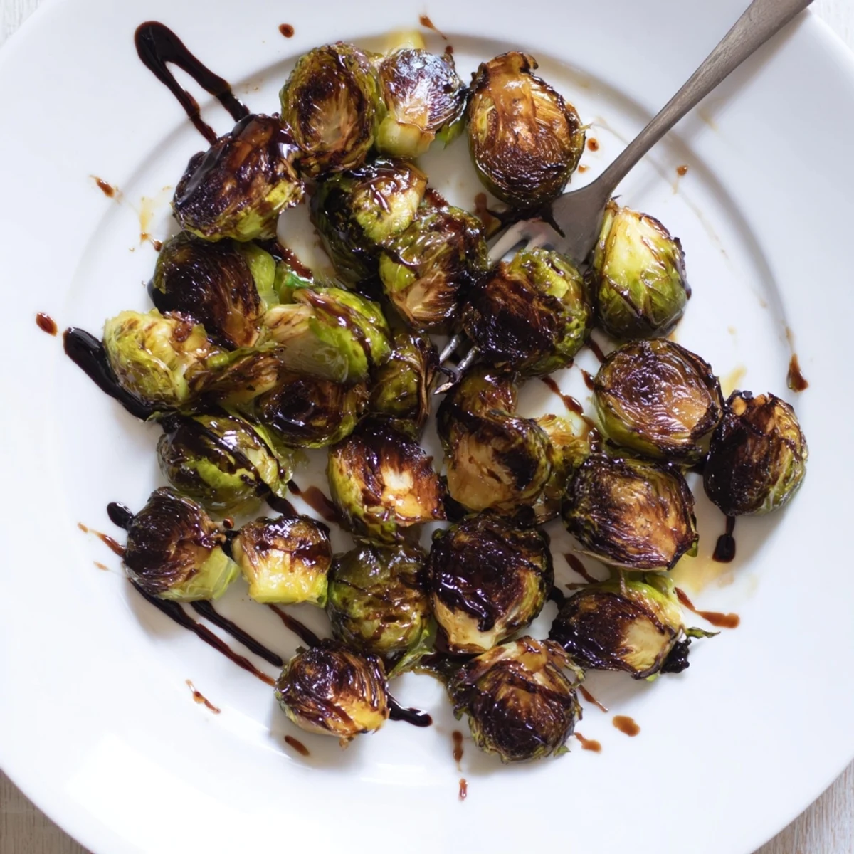 Roasted Brussels Sprouts with Balsamic: fork-tender, caramelized sprouts drizzled beautifully.