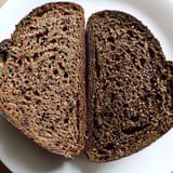 Warm, freshly baked Estonian Leib Sourdough with a beautiful, rich, brown crust; perfect with butter.