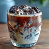 Decadent cookies and cream cold brew featuring smooth cold brew, chocolate sandwich cookies, and a hint of vanilla for a sweet treat.