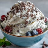 TikTok Cottage Cheese Ice Cream, showcasing a tempting swirl of berries and a smooth finish.