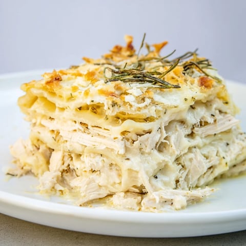 Golden, bubbly Rosemary Chicken Lasagna fresh from the oven, ready to serve and enjoy.