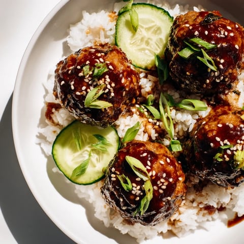 Golden-brown Teriyaki Meatball Bowls, a flavorful, homemade dish drizzled with sweet teriyaki goodness, ready to enjoy.