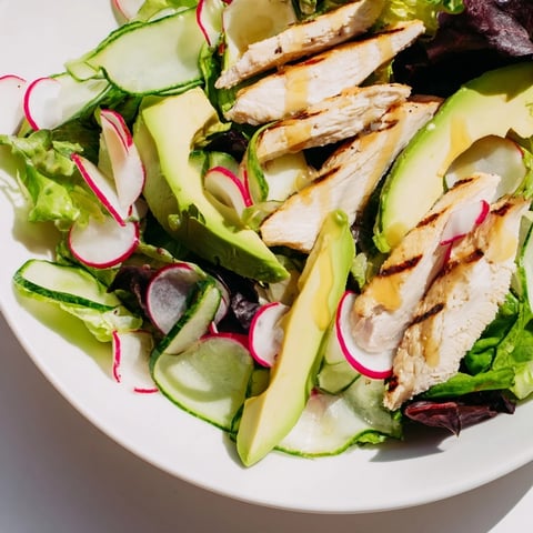 Fresh grilled chicken slices and crisp cucumbers over mixed greens with radish in the Spring Detox Chicken Salad, drizzled with lemon vinaigrette.