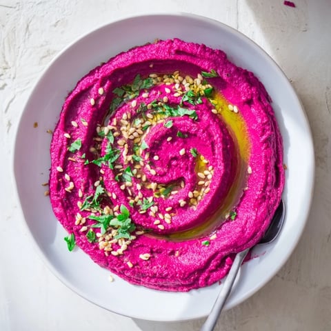 Vibrant Roasted Beet Hummus with creamy tahini, ready for dipping.