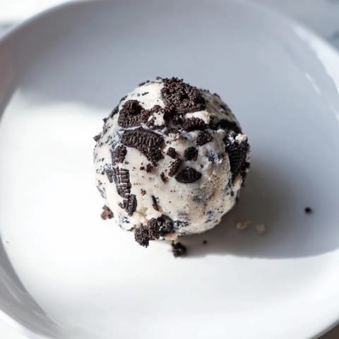 Enjoy the delicious texture of these homemade Cream Cheese Oreo Protein Balls, a tasty and healthy treat.