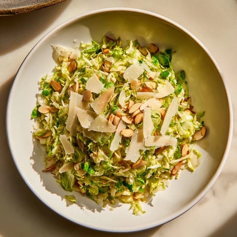 Fresh Crunchy Lemon Parmesan Brussels Sprouts Salad: a vibrant, raw salad with almond crunch and savory Parmesan.