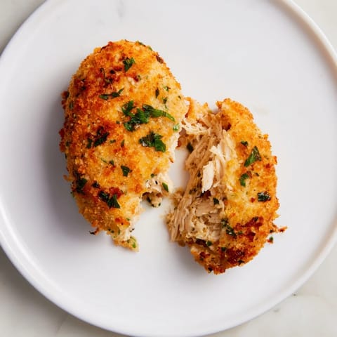 Close-up of freshly air fried spicy ranch chicken croquettes, showcasing their perfect, golden crust.