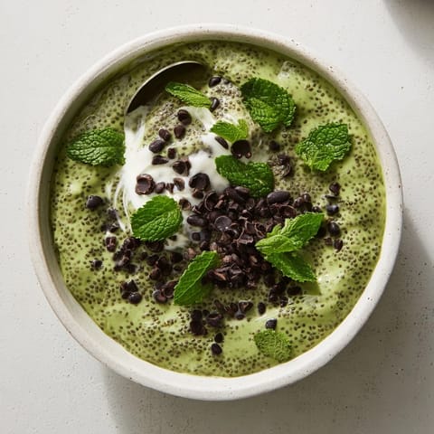 Creamy, refreshing Grinch Green Mint Matcha Breakfast Chia Pudding, perfect vegan breakfast with fresh berries.