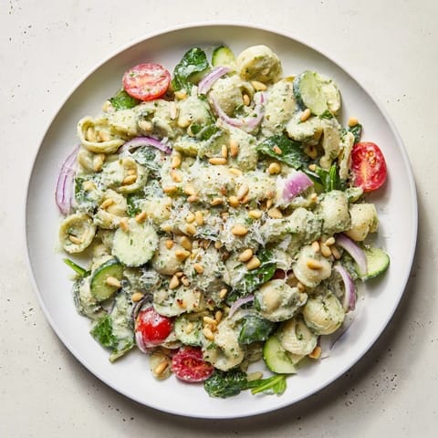 This Caesar Pesto Ditalini Salad shows off perfectly cooked pasta, coated in a flavorful pesto-Caesar blend.