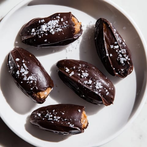These Chocolate Peanut Butter Dates are a perfect no-bake dessert, showcasing rich chocolate and salty sea salt.