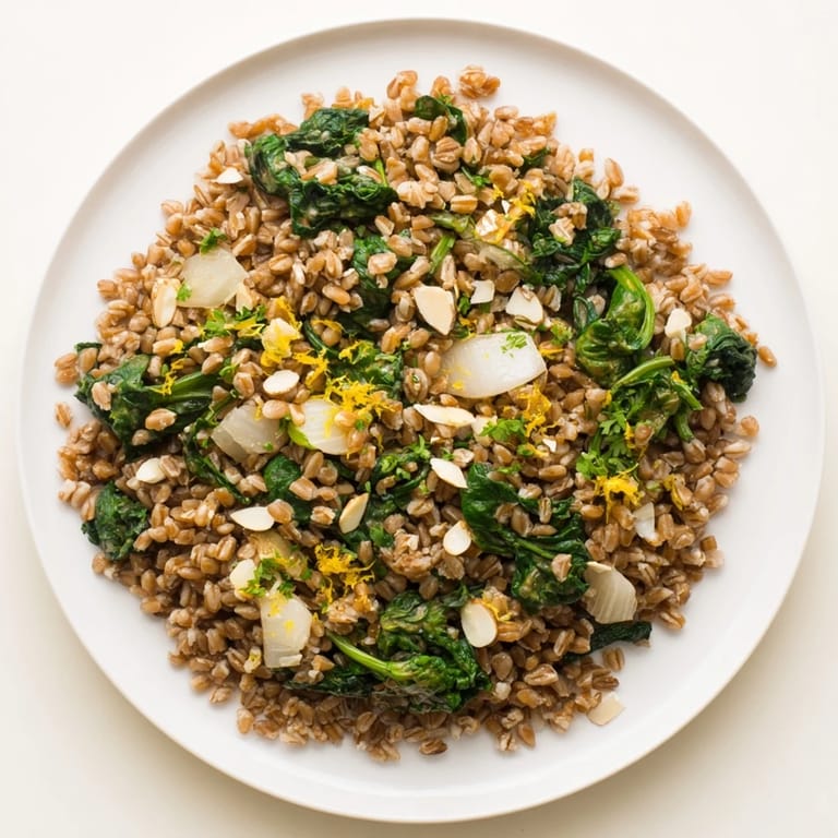 Vibrant farro & greens pilaf features a medley of flavors, with fluffy farro and fresh herbs.