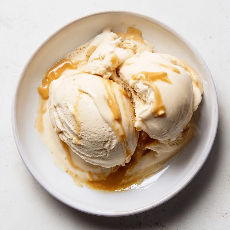 A close-up view of homemade Peanut Butter Banana Ice Cream, perfectly blended with hints of peanut butter flavor.