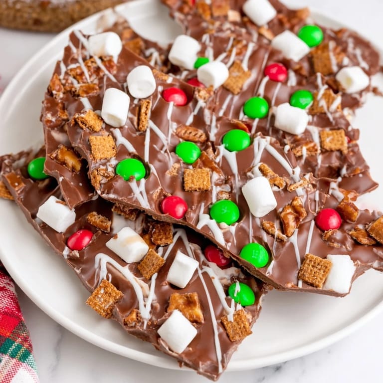 This Quick Christmas Smores Bark is a delicious combination of chocolate, graham crackers and holiday colors.