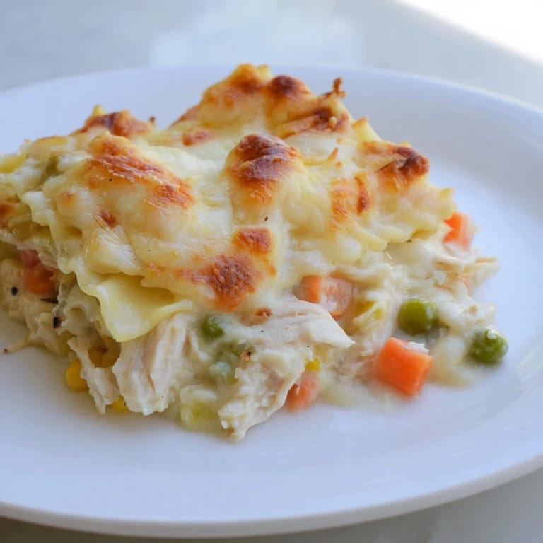 This delicious oven-baked Chicken Pot Pie Ravioli combines tender pasta, chicken, and is covered with cheese.