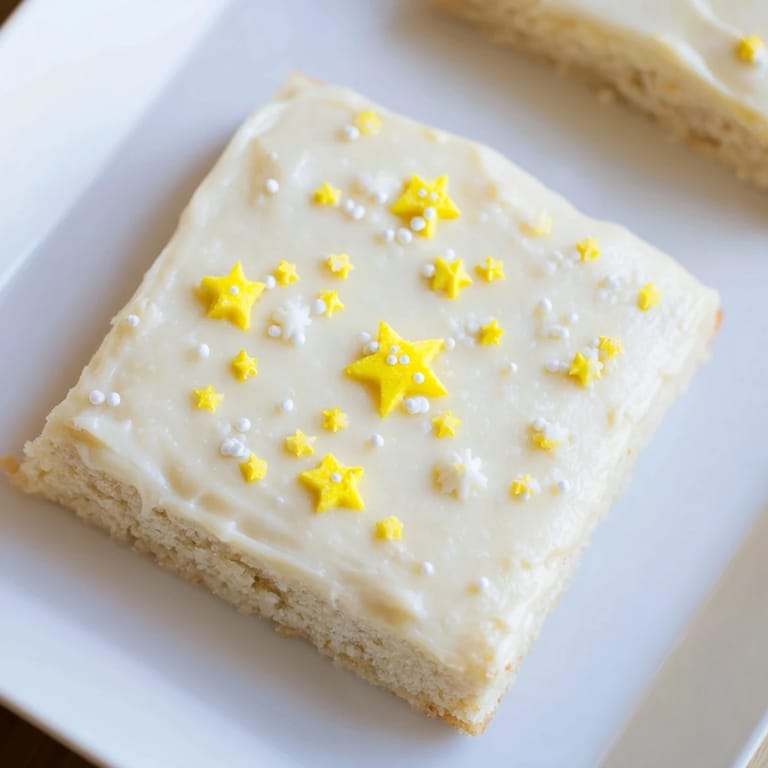 Golden-baked Twinkle Twinkle Star Dessert Bars, cut and presented with sparkling star toppings.