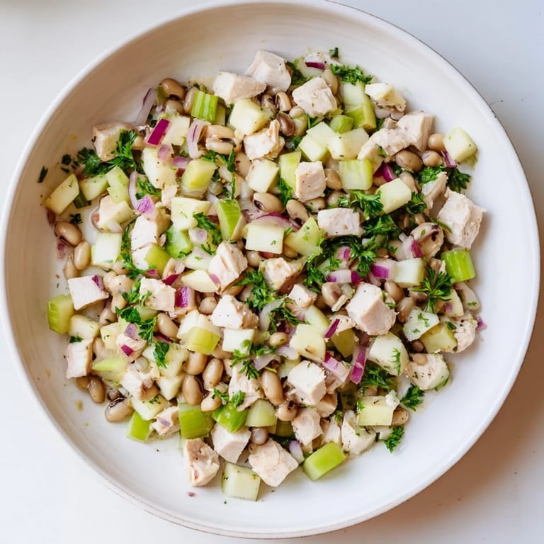 This refreshing Chicken and Apple New Years Luck Salad features bright red apple pieces alongside tender chicken.