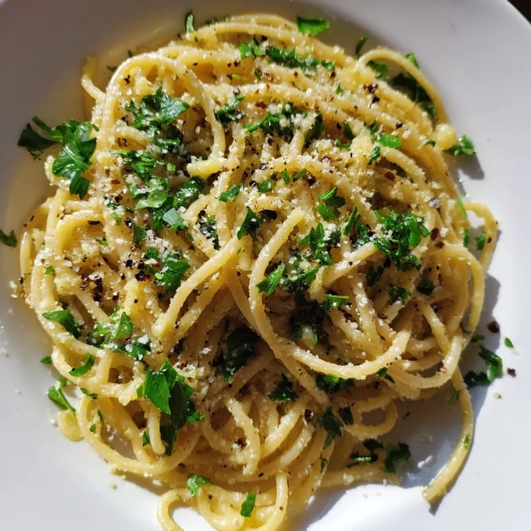 Creamy Garlic Butter Noodles, with optional Parmesan and lemon zest, a simple American comfort.