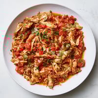 Steaming Crock-Pot Shredded Chicken Tacos, piled high with colorful toppings, ready to enjoy.