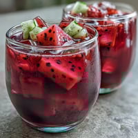 Vibrant mango dragonfruit refresher with frozen fruit, citrus, and ice—tropical and refreshing homemade Starbucks copycat.